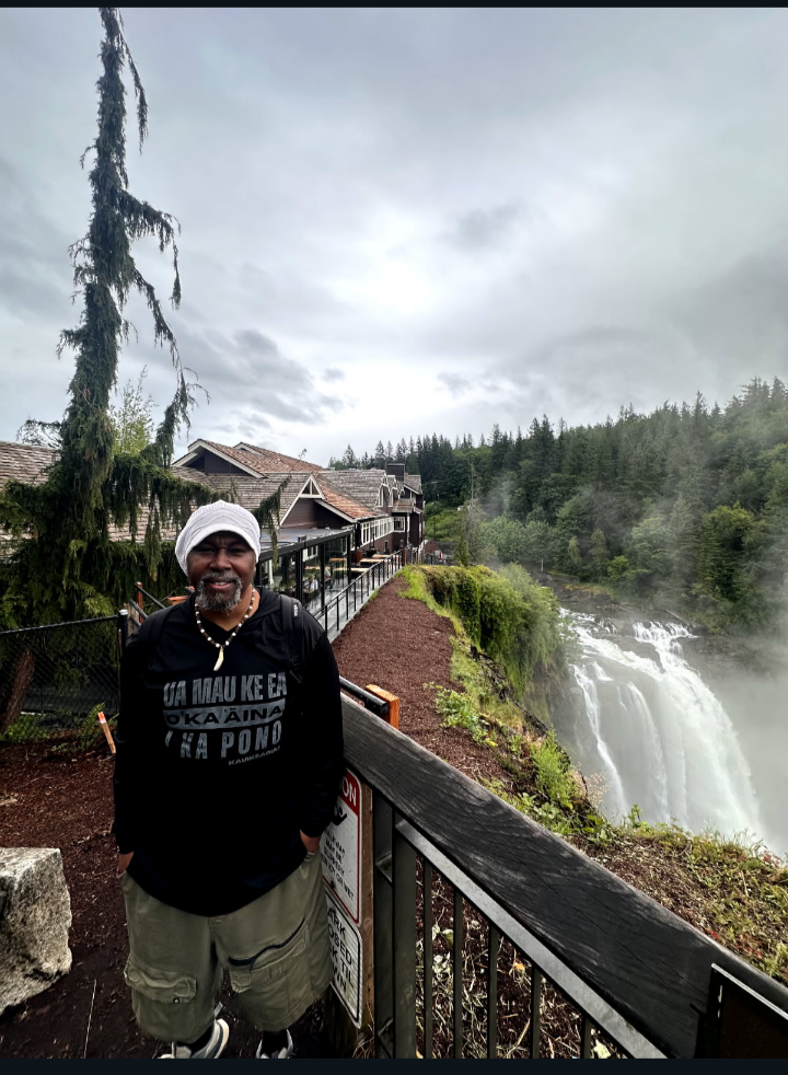 Rodney Alamo Brown overlooking a waterfall